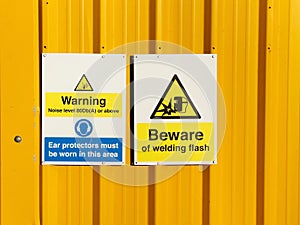 Construction site health and safety message rules sign board signage on fence boundary