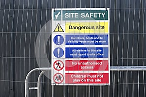 Construction site health and safety message rules sign board signage on fence boundary