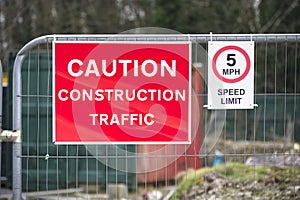 Construction site health and safety message rules sign board signage on fence boundary