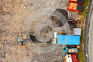 Construction site with heavy machinery, Aerial top down view. Building industry. Development area for commercial or residential