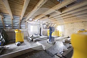 Construction site inside a single-family house - upper floor with wooden roof beams