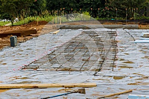 Construction site of installation reinforcement steel bars to concrete foundations during the construction process