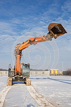 Construction site, a large working machine is a crawler excavato