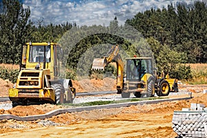 Construction site is laying new asphalt road pavement,road construction workers and road construction machinery scene