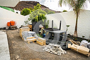 Construction site materials and tools in garden backyard
