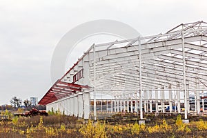 Construction site. Metal structure frame of industrial building