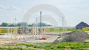 construction site of a new Dutch Suburban area with modern family houses, newly build family homes