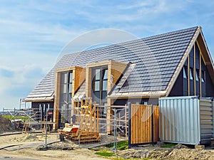 construction site of a new Dutch Suburban area with modern family houses, newly build family homes