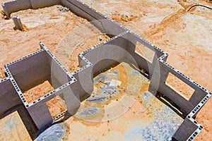 Construction site on new home foundation with concrete blocks the aerial view