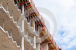 Construction site with a new modern building made with concrete as city development and futuristic architecture is the workplace