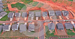 The construction site of a newly built home development is situated under residential houses in the suburbs