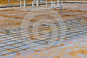 At the construction site, reinforcement steel bars are being made for the concrete foundations