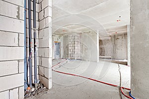 Construction site residential apartment building interior in white concrete progress