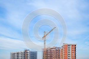 Construction site, residential building project development and construction crane