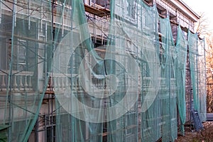 Construction site restoration work on the renovation of the old facade of the building