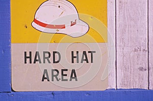 A construction site sign hard hat area