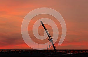 Construction site  silhouette on sunset background