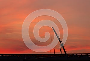 Construction site  silhouette on sunset background