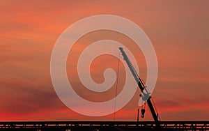 Construction site  silhouette on sunset background