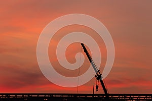 Construction site  silhouette on sunset background