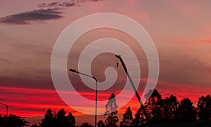 Construction site  silhouette on sunset background