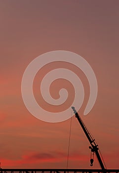 Construction site  silhouette on sunset background