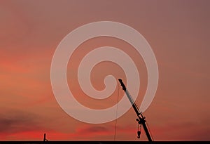 Construction site  silhouette on sunset background