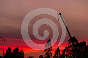 Construction site  silhouette on sunset background