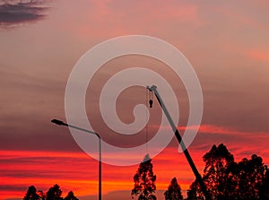 Construction site  silhouette on sunset background