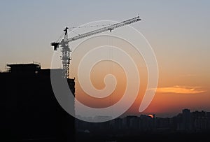 Construction site silhouettes in Beijing after sunset