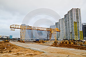 A construction site with specialized professional equipment and cranes during the construction of a modern line