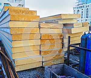 Construction site with stacked PUR sandwich panels. Prefabricated Insulating Building Materials photo