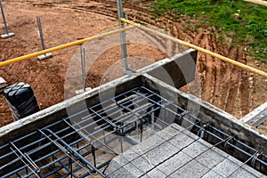 Construction site with steel formworks and reinforcing bars for