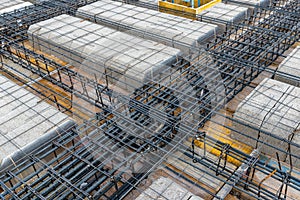 Construction site with steel formworks and reinforcing bars for