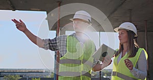 Construction site Team or architect and builder or worker with helmets discuss on a scaffold construction plan or