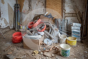 On  construction site there is a lot of waste and tools in a big pile