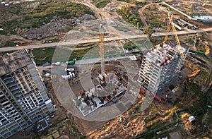 Construction site with tower crane on formworks. Crane on construction the building and multi-storey residential homes. Housing