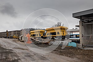 Construction site of a train station of Grosuplje, that is being renovated. Cold spring day with clouds, visible yellow gravel