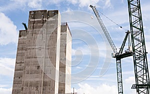 Construction site with two big cranes and concrete core of new s