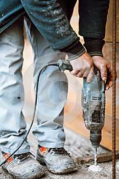 construction site using drilling machine, bricklaying and boring details