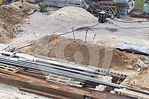 Construction site. View from top. Wheelbarrow and shovels.