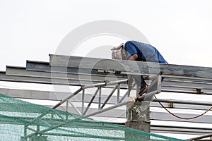 In the construction site, the welding workers at work.