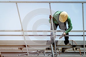 In the construction site, the welding workers at work.