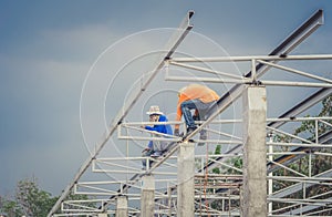 In the construction site, the welding workers at work.