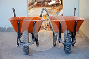 Construction site with wheelbarrows ready for work.