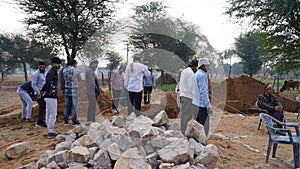 Construction site on work. People inspecting and working on the site for making a building
