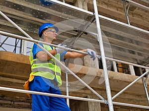Construction site worker talking with a walkie talkie stock picture