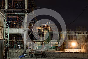 Construction site with Worker working at night