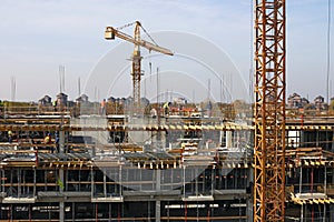 Construction site with workers and cranes industry