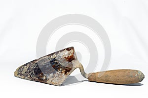 Construction spatula used on a white background. Looking up photo